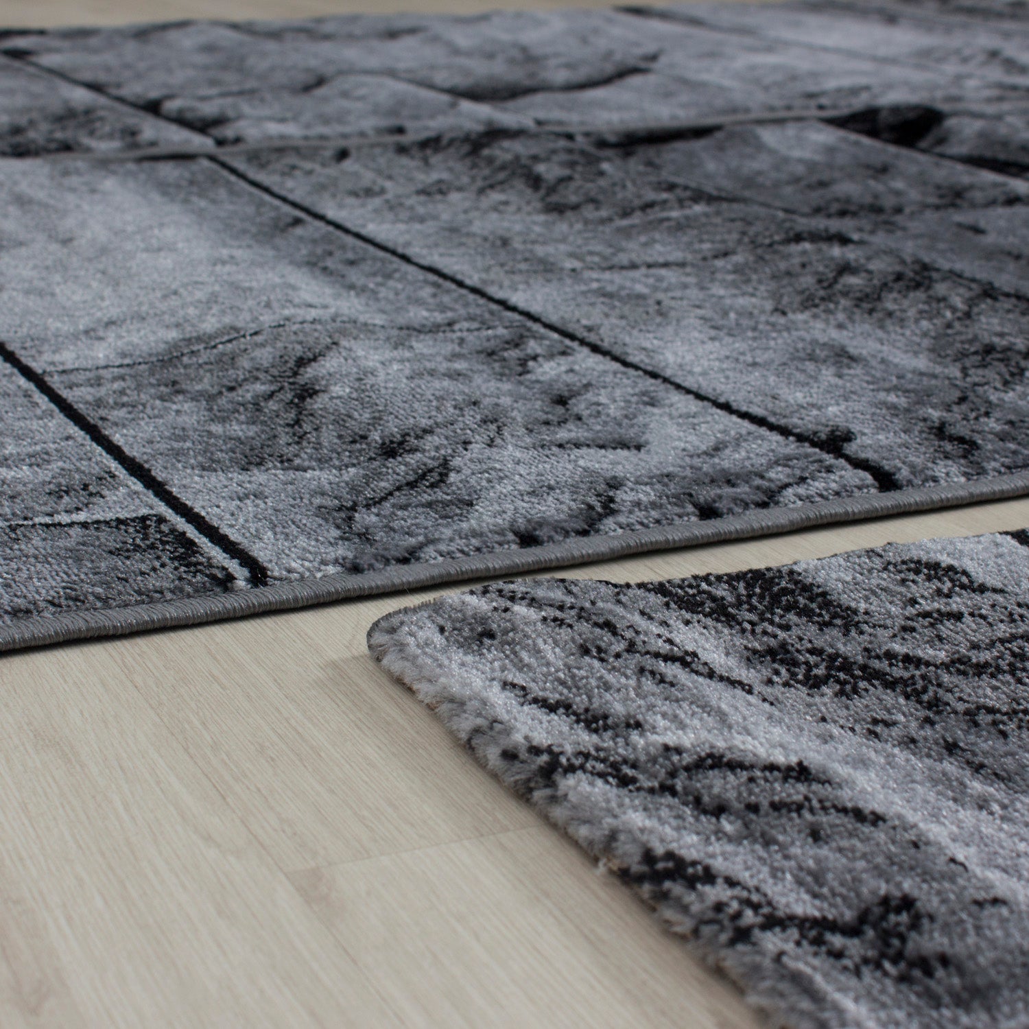 Set de tapis bordure de lit 3 pièces aspect pierre noir gris chiné